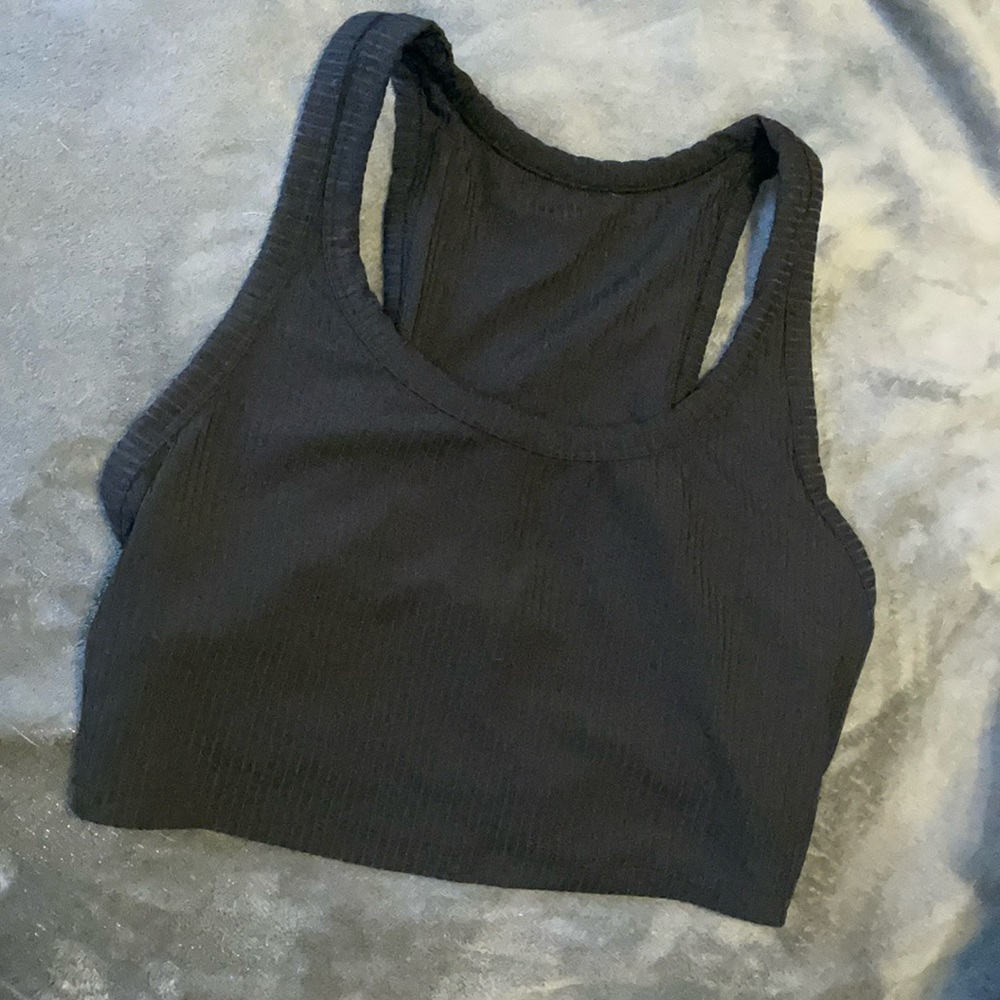 Small, all in motion black sports top. Built-In bra. Never worn.